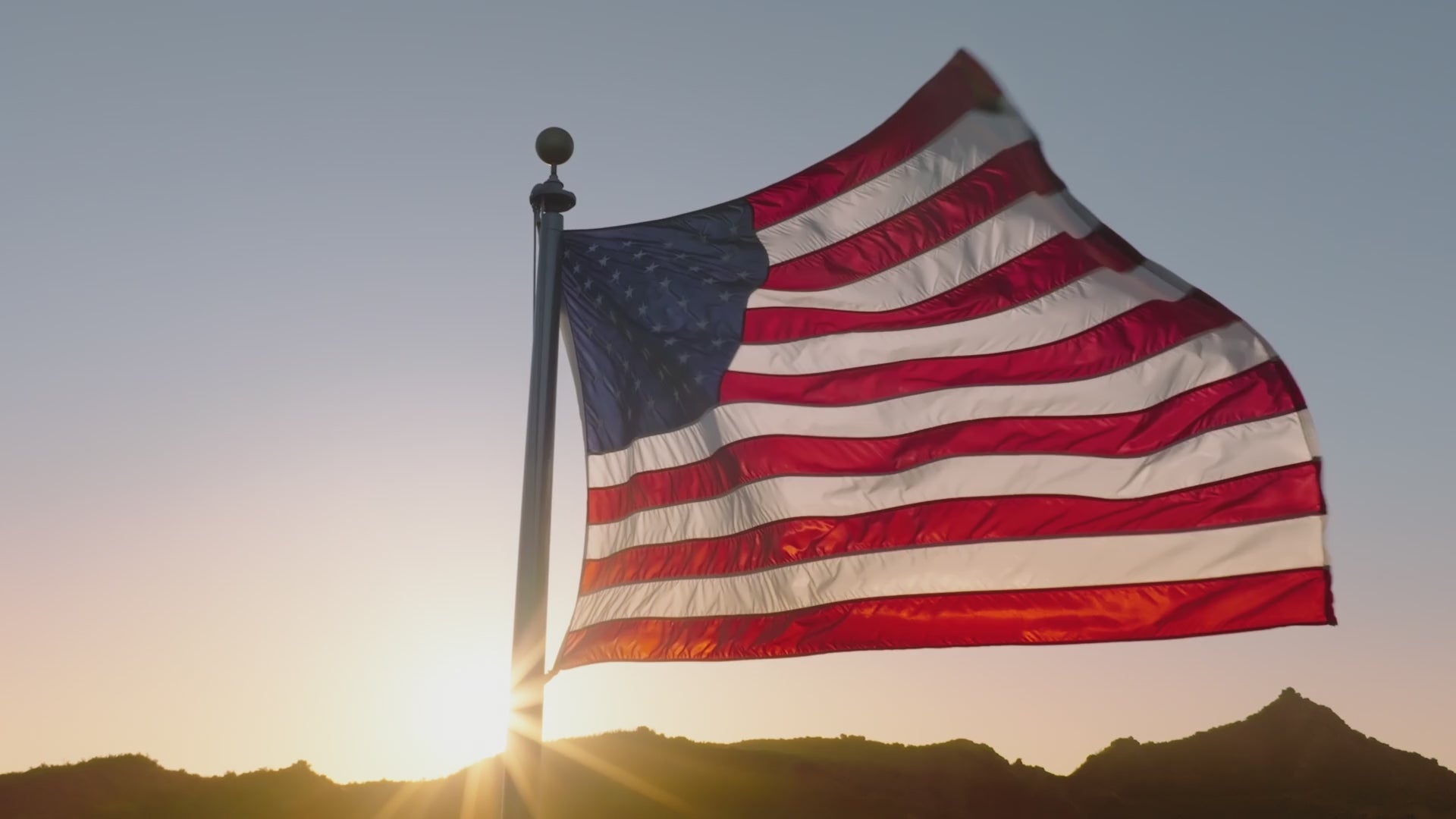 Load video: American Flag Waving in the Sunset